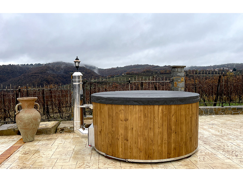 Hot tub with internal wood...